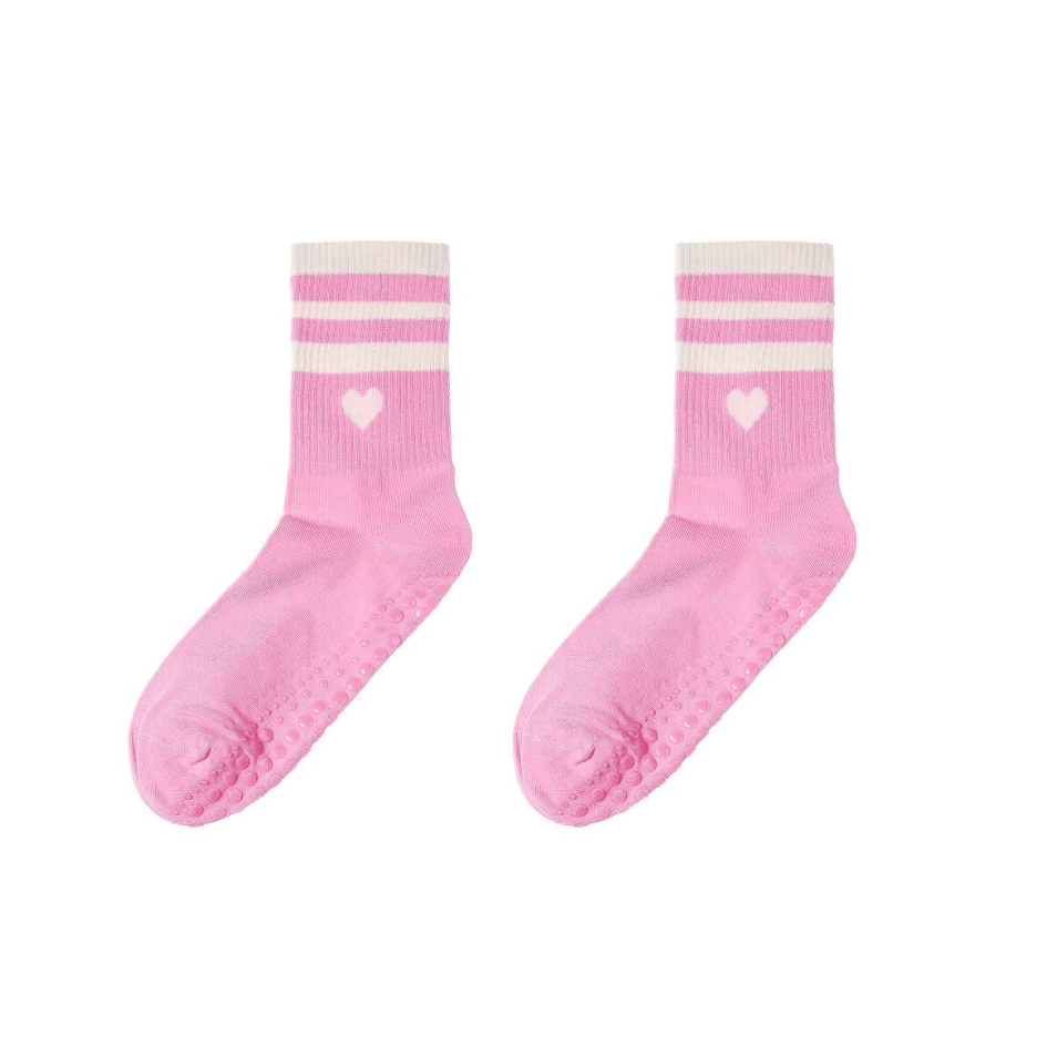 Rosa Damen Yoga-Socken mit weißen Streifen, weißem Herz und Anti-Rutsch-Noppen auf der Sohle, Größe 36–41.