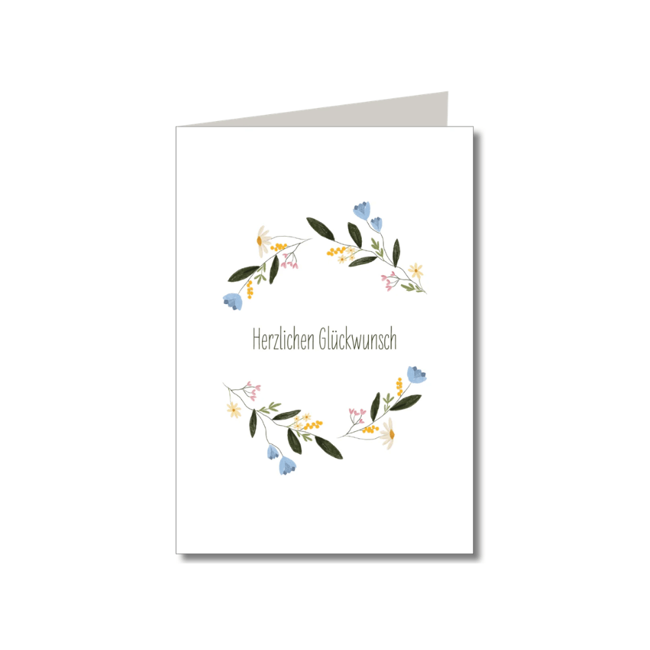 Weiße Klappkarte „Herzlichen Glückwunsch“ von Keitcards mit zarten bunten Blumenzweigen und braunem Naturpapier-Umschlag.