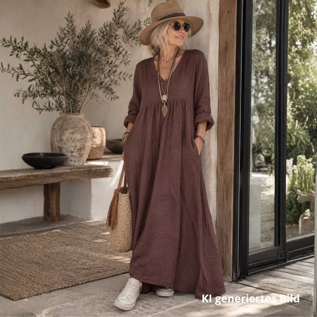 Langes dunkelbraunes Damen-Leinenkleid aus 100 % Leinen mit V-Ausschnitt, langen Ärmeln und seitlichen Taschen im natürlichen Boho-Stil.